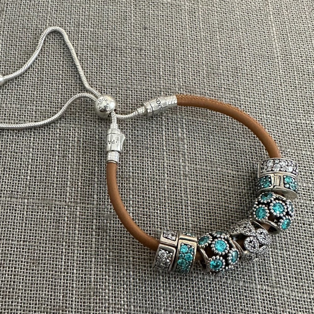 PANDORA ADJUSTABLE BROWN LEATHER STRAP BRACELET WITH 7-PANDORA CHARMS